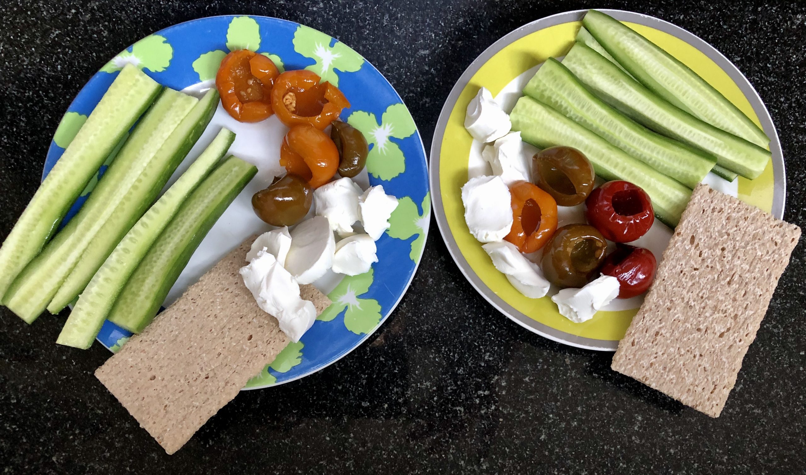Mediterranean diet breakfast: marinated mini peppers, cucumbers, goat cheese and crackers