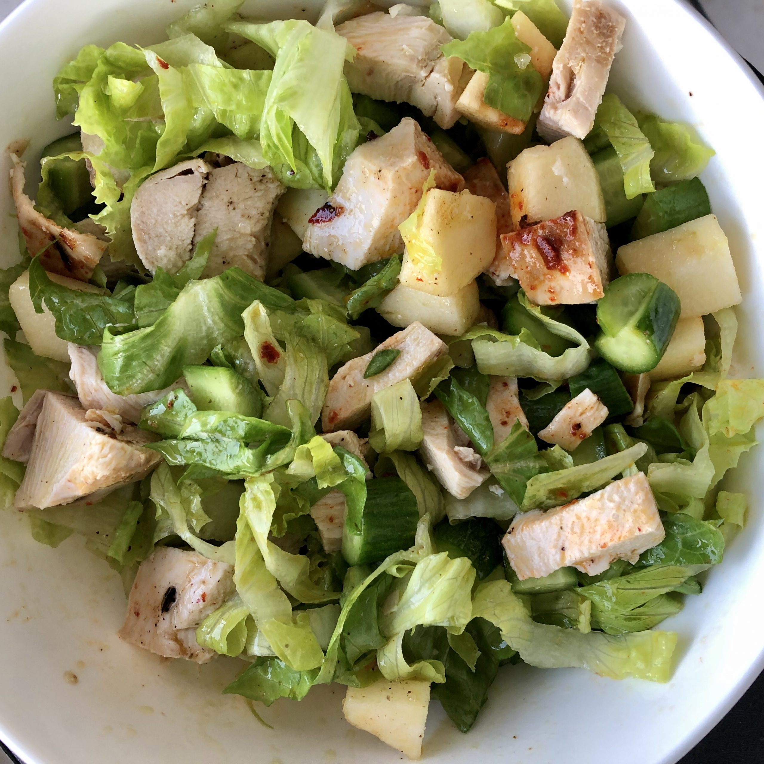 Chicken salad with lettuce, cucumbers and apples