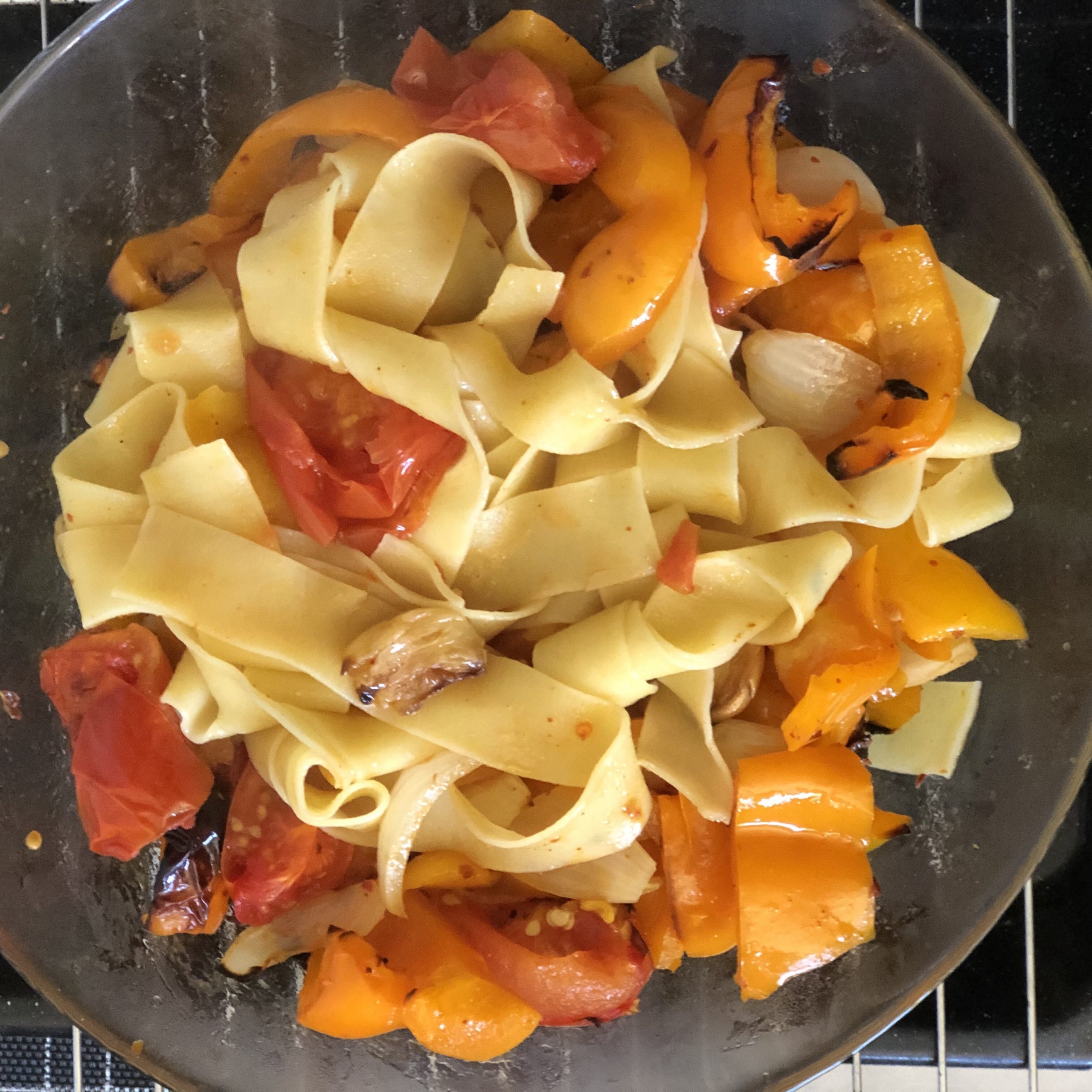 Pappardelle with roasted peppers, tomatoes, onions, chili, garlic and olive oil