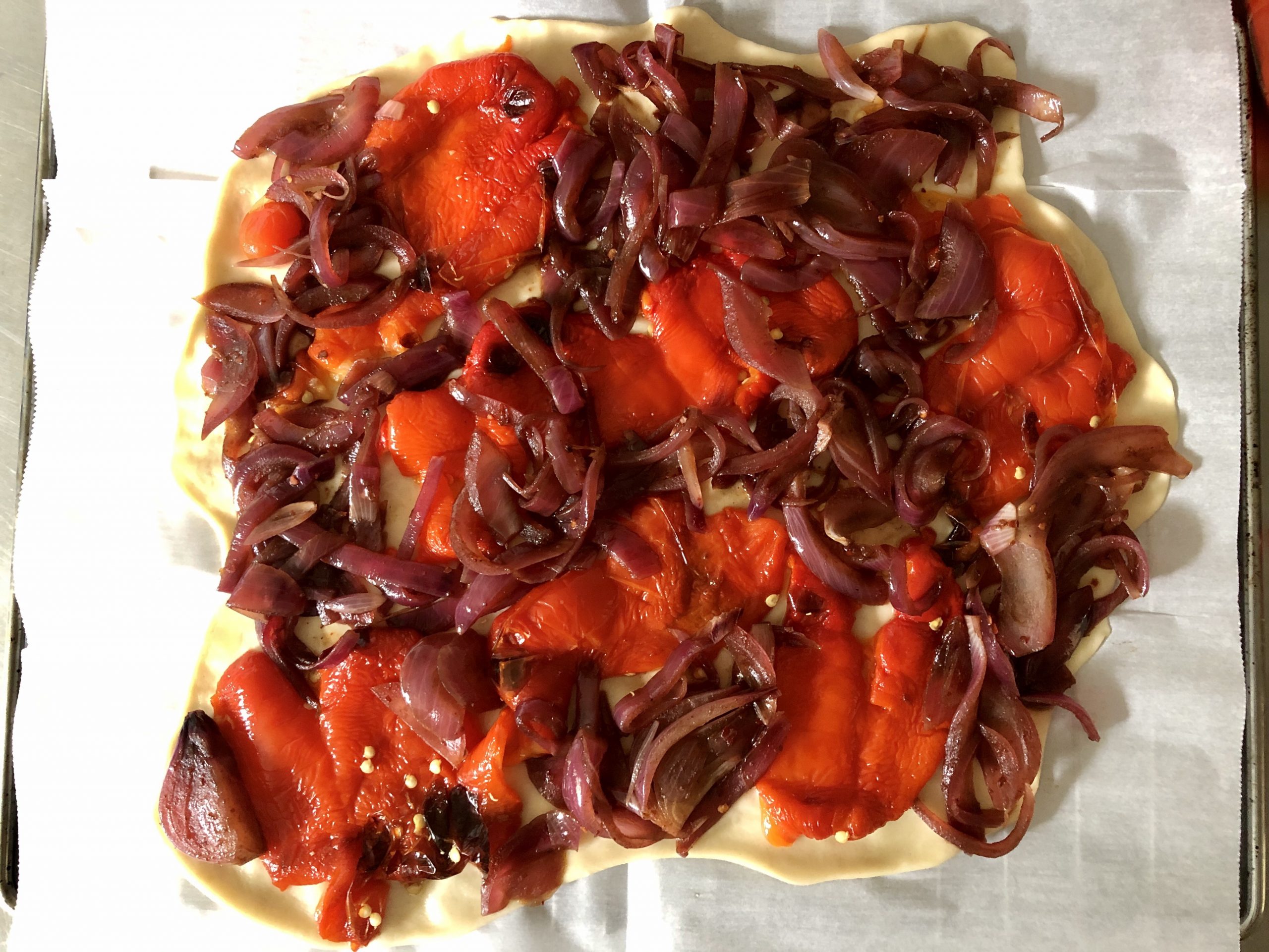 Galette with roasted red peppers, caramelized onions and goat cheese