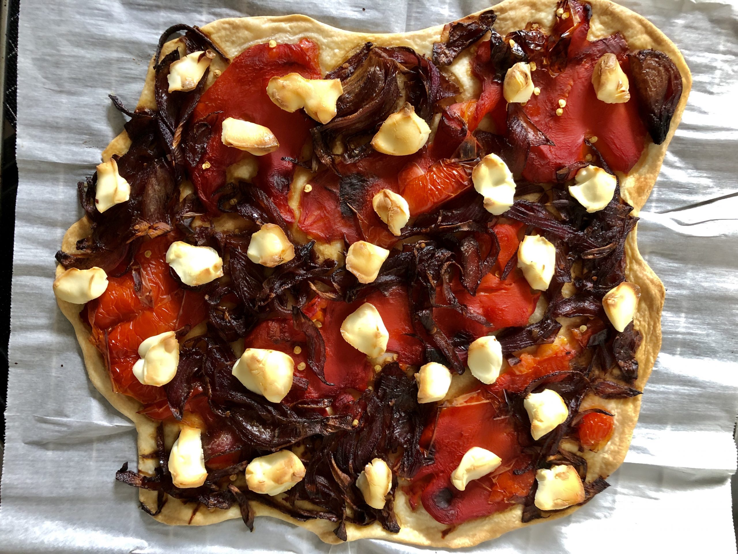 Galette with roasted red peppers, caramelized onions and goat cheese